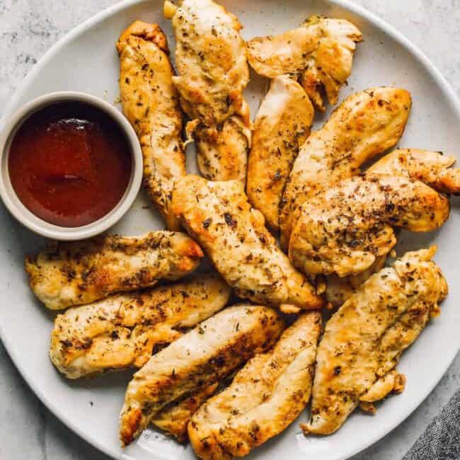 instant pot chicken tenders next to bbq sauce