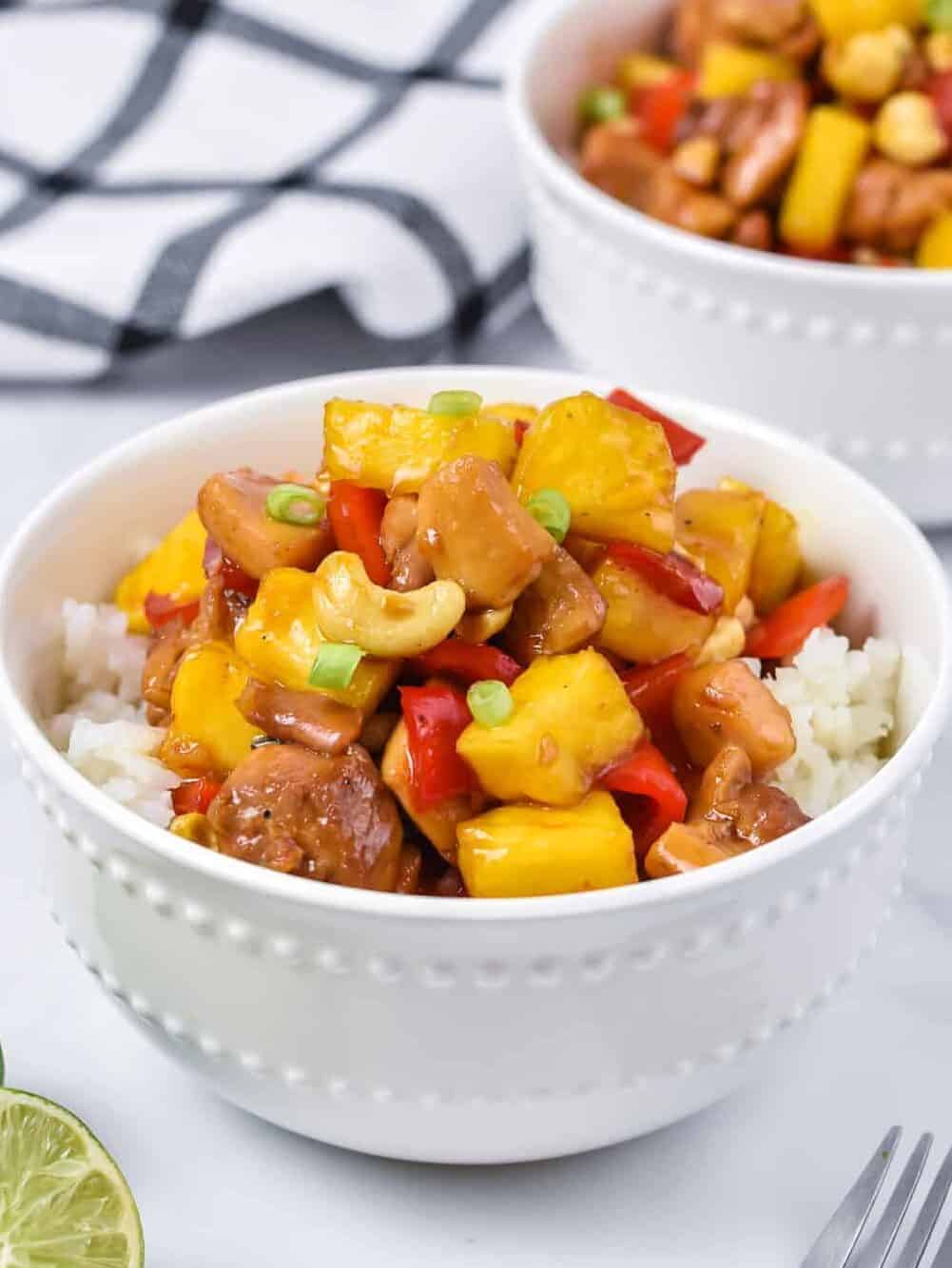 chicken with pineapple and rice in a white bowl
