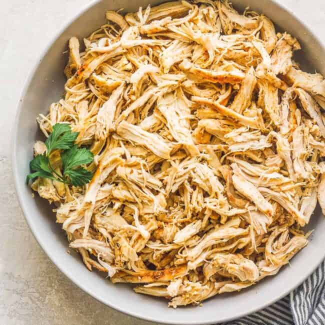 shredded chicken in white bowl