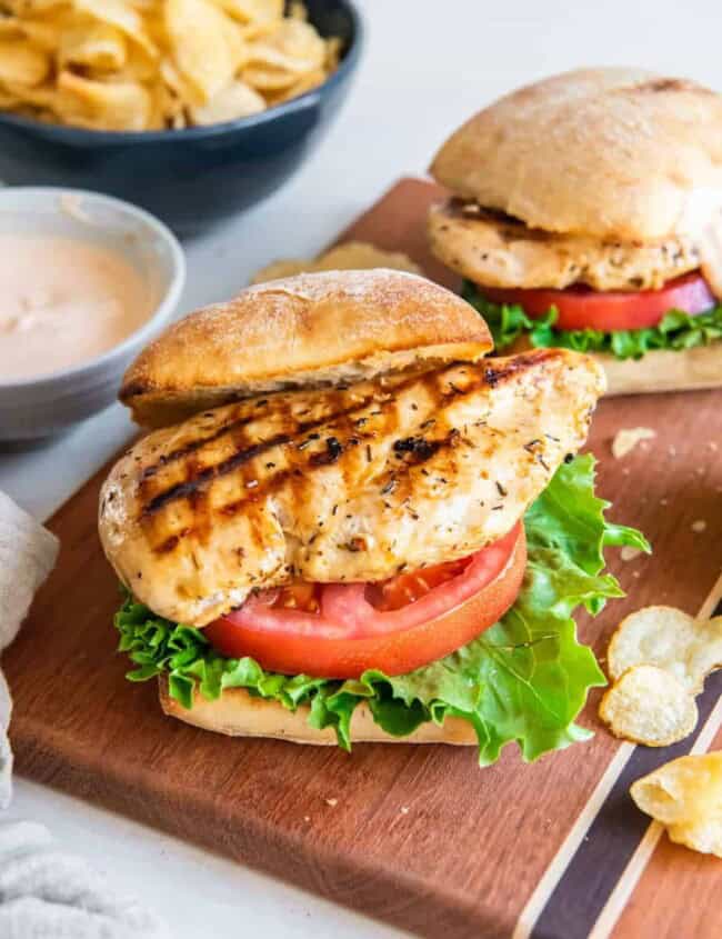 grilled chicken sandwiches on a cutting board