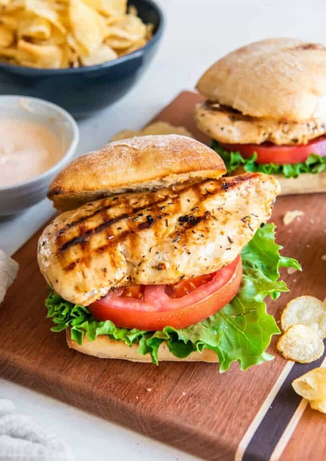 grilled chicken sandwiches on a cutting board