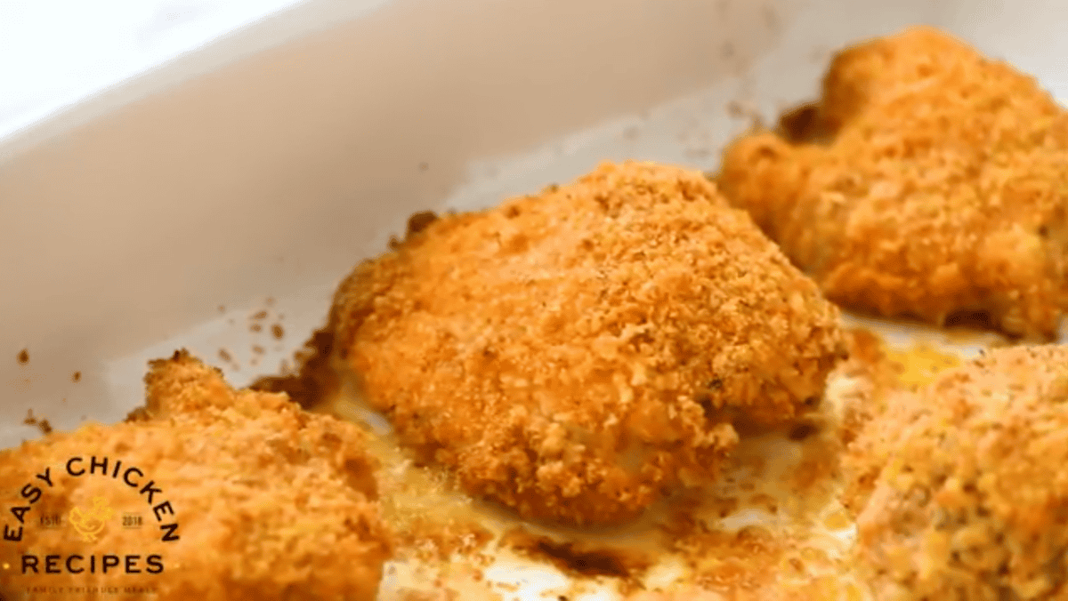 parmesan crusted chicken in a baking dish.