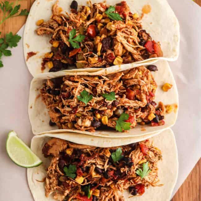 three shredded chicken tacos