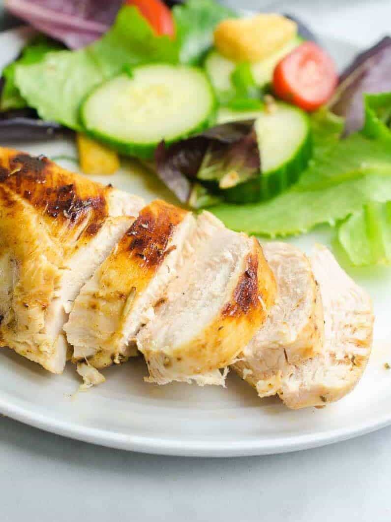 sliced chicken breast with salad