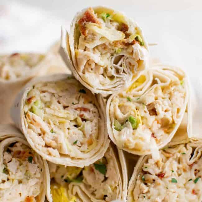 stack of chicken ranch wraps on a white plate