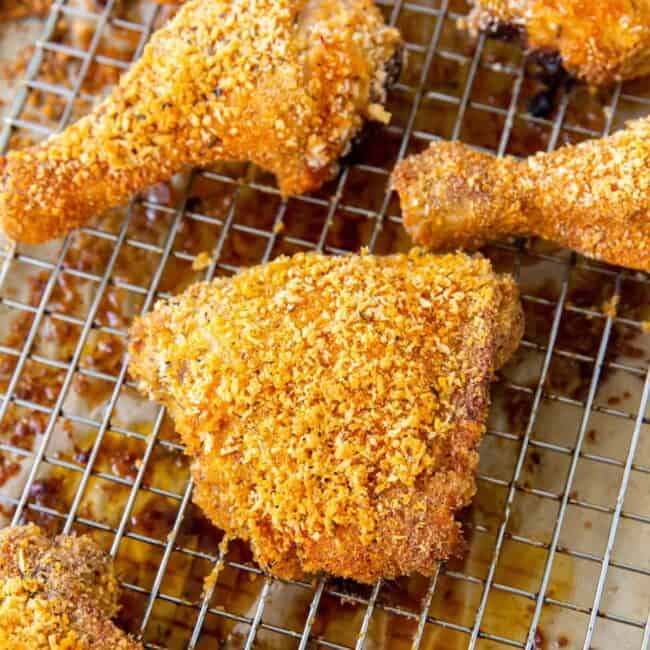 homemade shake and bake chicken arranged on a cooling rack