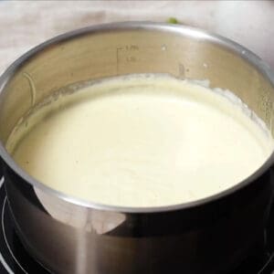 cheese sauce in a saucepan.