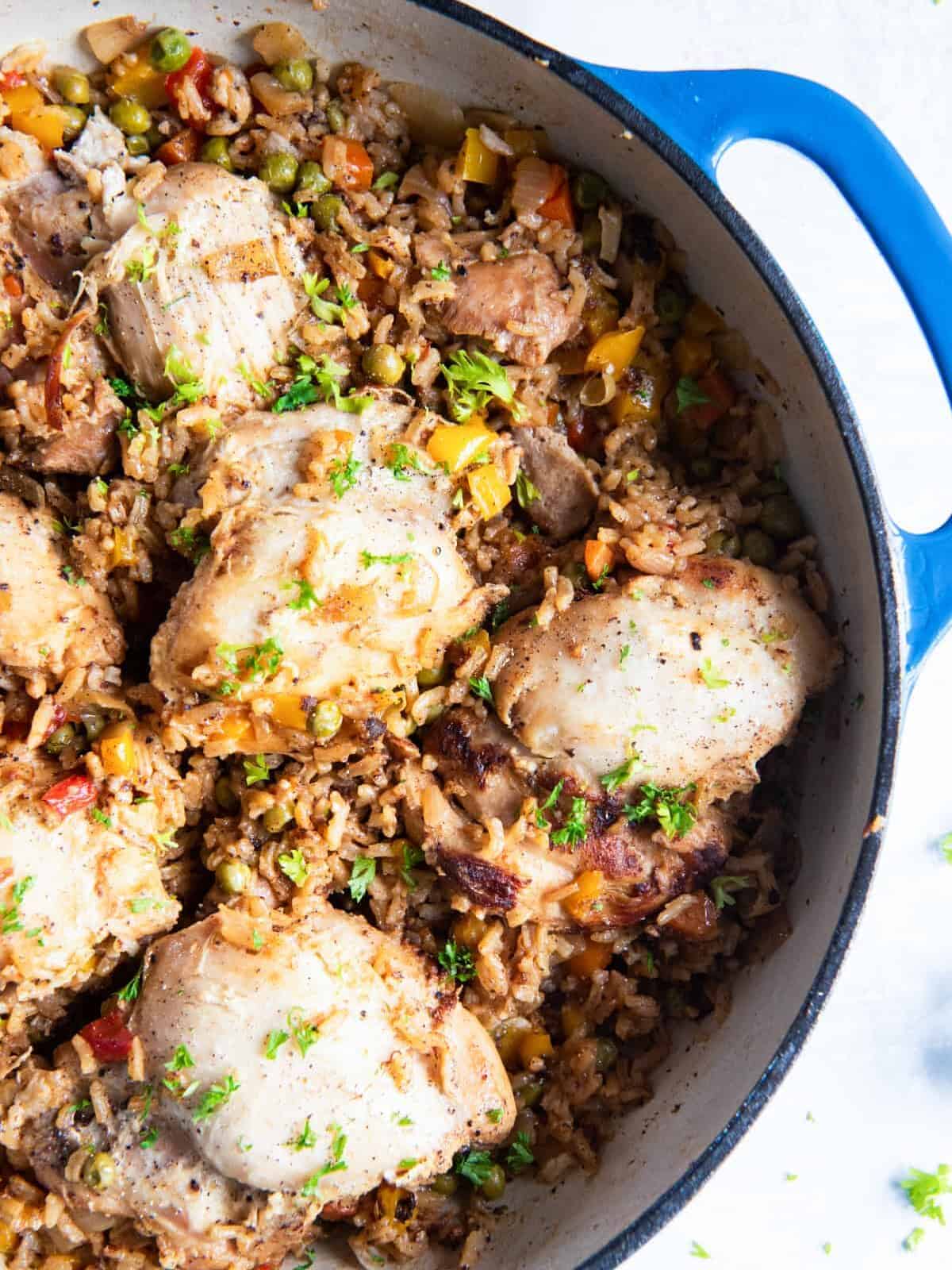 close up on a pot of chicken thighs and rice