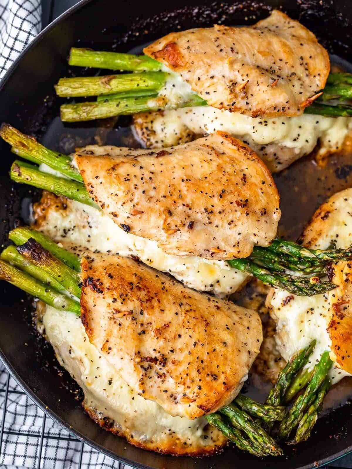 Cheesy Asparagus Stuffed Chicken Breast in skillet