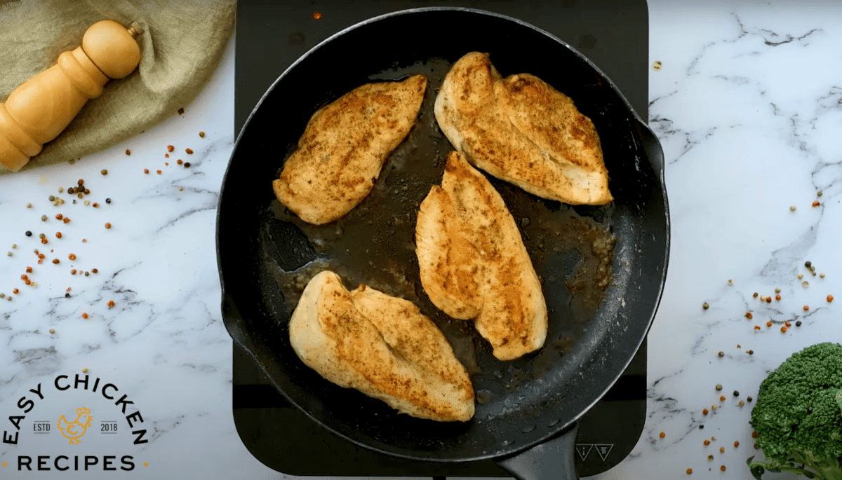 seared chicken breasts in a cast iron skillet.