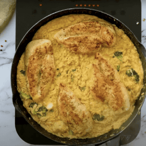 cheesy chicken and rice in a cast iron skillet.