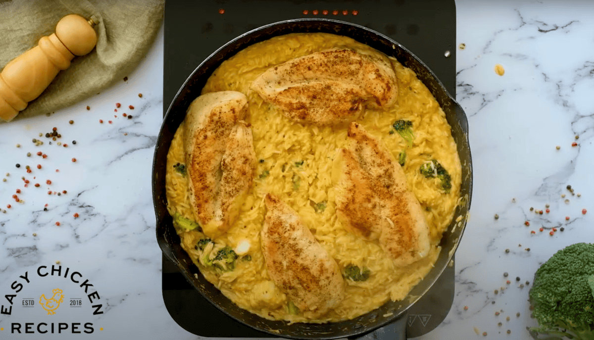 cheesy chicken and rice in a cast iron skillet.