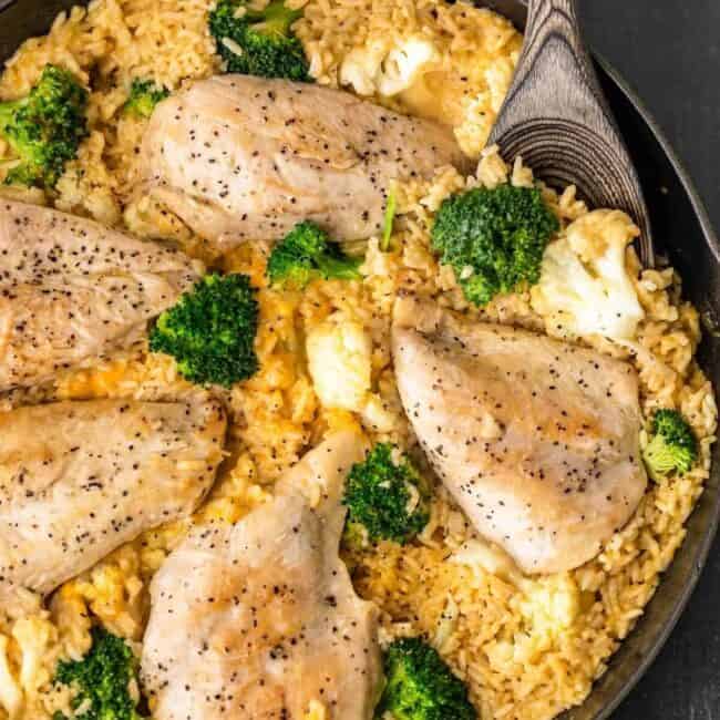 One Pot Cheesy Chicken and Rice is our GO TO simple weeknight meal the entire family loves. Cheesy Chicken and Broccoli is comfort food with none of the fuss. Creamy, easy, quick, and delicious!