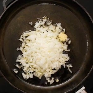 finely chopped onion and garlic in a pan.