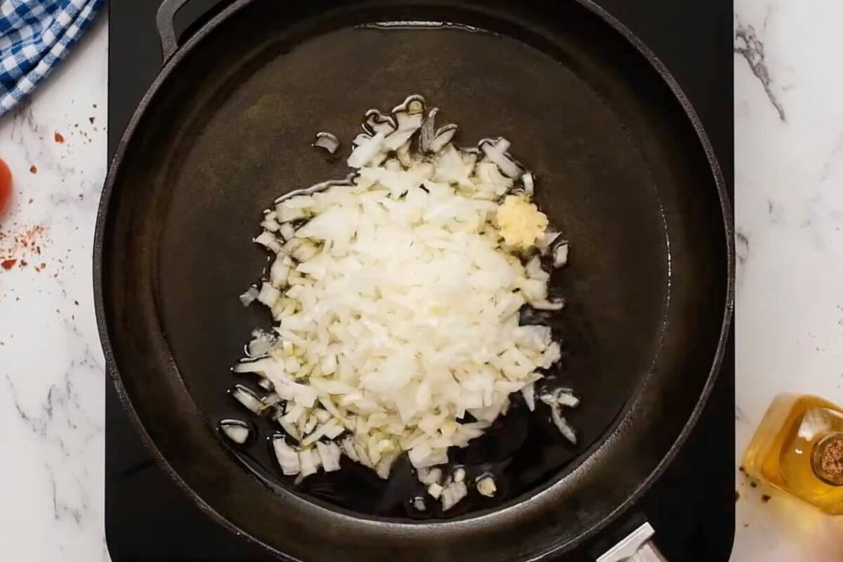 finely chopped onion and garlic in a pan.