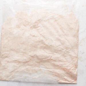 A bag of powdered sugar on a white background.