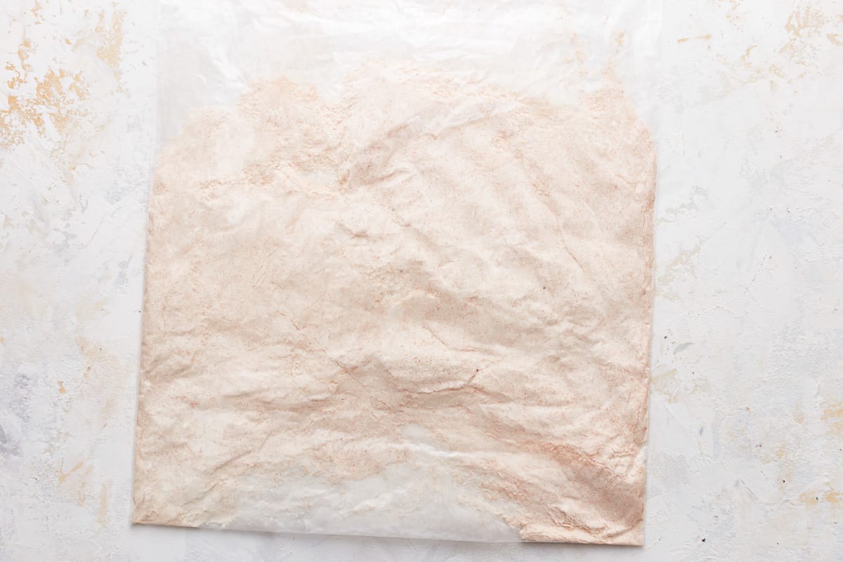 A bag of powdered sugar on a white background.