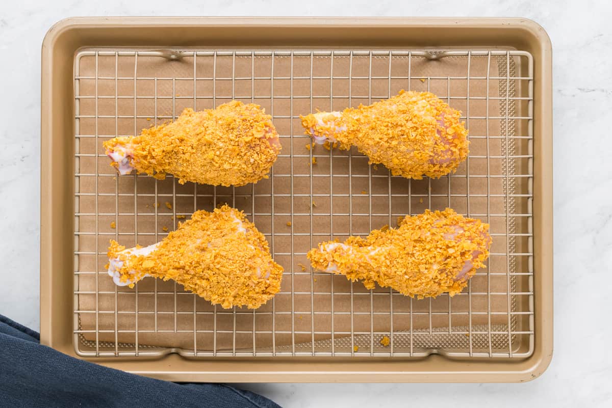 Fried chicken wings on a baking sheet.