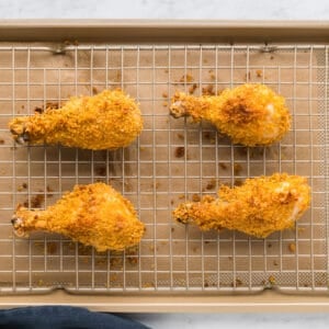 Fried chicken wings on a baking sheet.