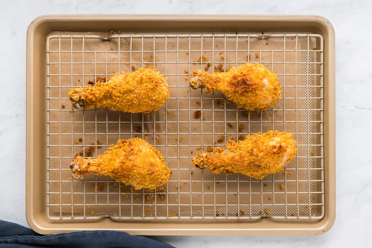Fried chicken wings on a baking sheet.