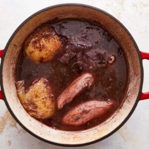 A pot of stew with meat and potatoes in it.