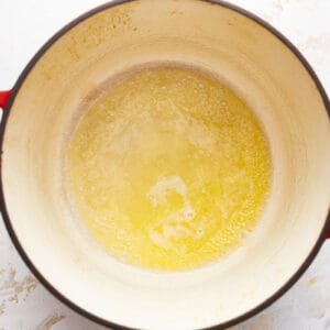 A pot filled with yellow liquid on a white surface.