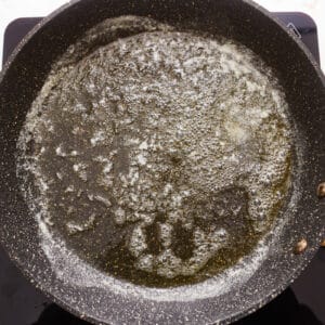 A frying pan with oil in it.