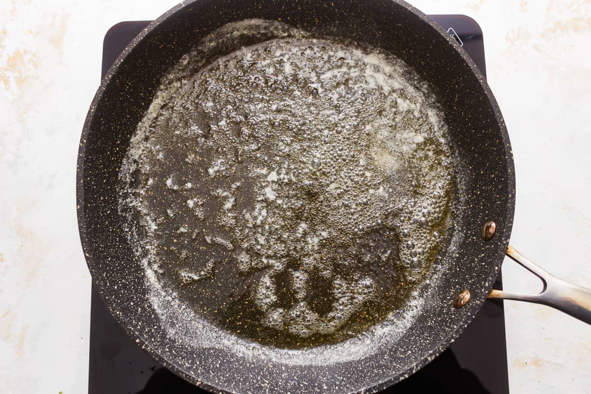 A frying pan with oil in it.