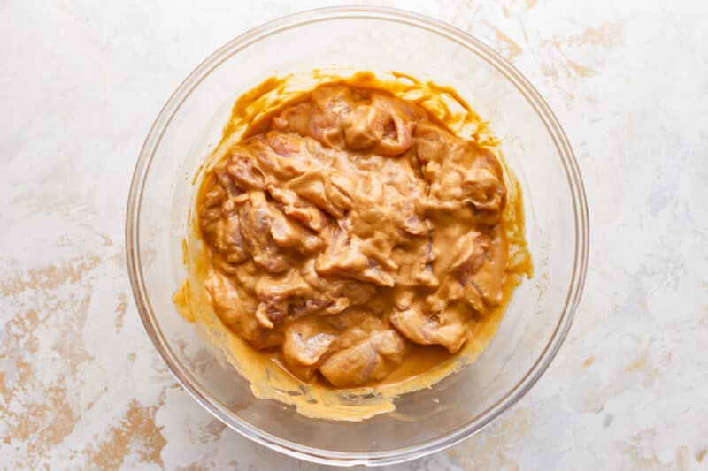 A bowl of peanut butter in a glass bowl.