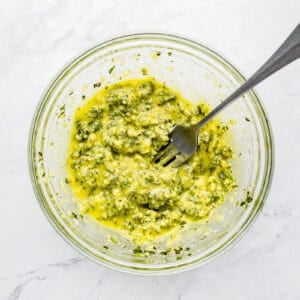 Pesto in a bowl with a fork.