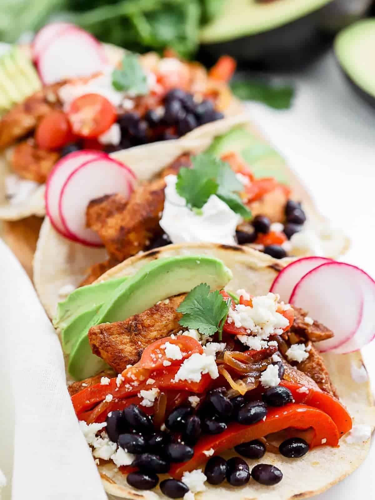 blackened chicken tacos with avocado and black beans