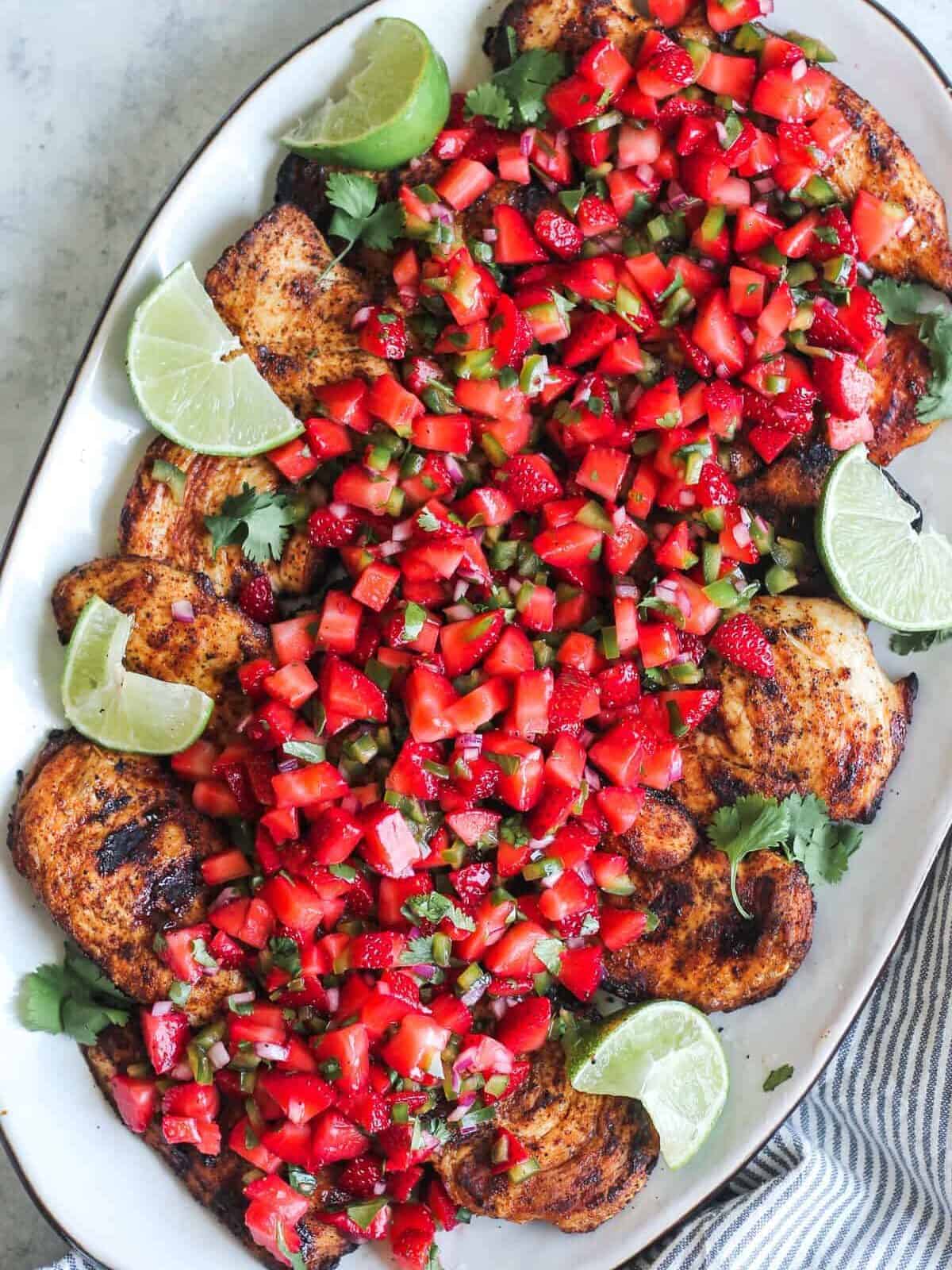 grilled chicken breast with strawberry salsa on platter