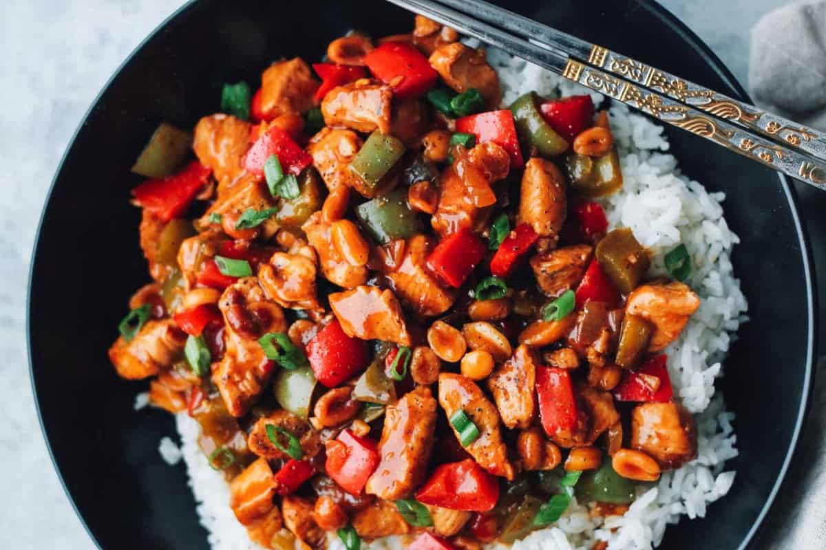 a bowl of Kung Pao Chicken recipe with rice and vegetables.