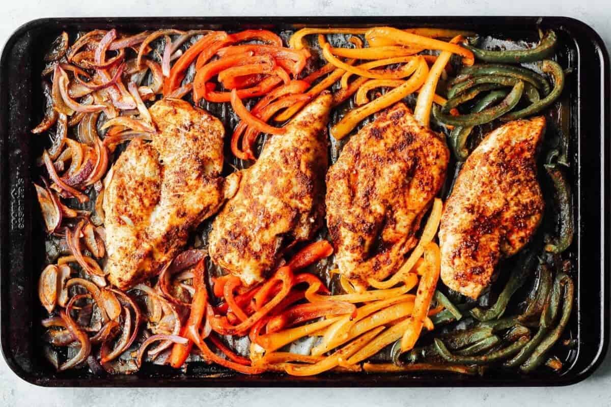 chicken fajitas and vegetables baked in the oven