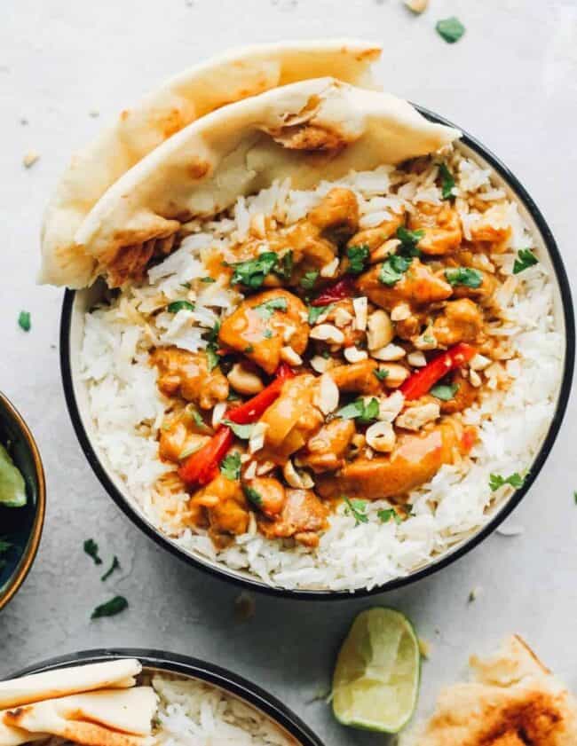 chicken curry in bowls over rice