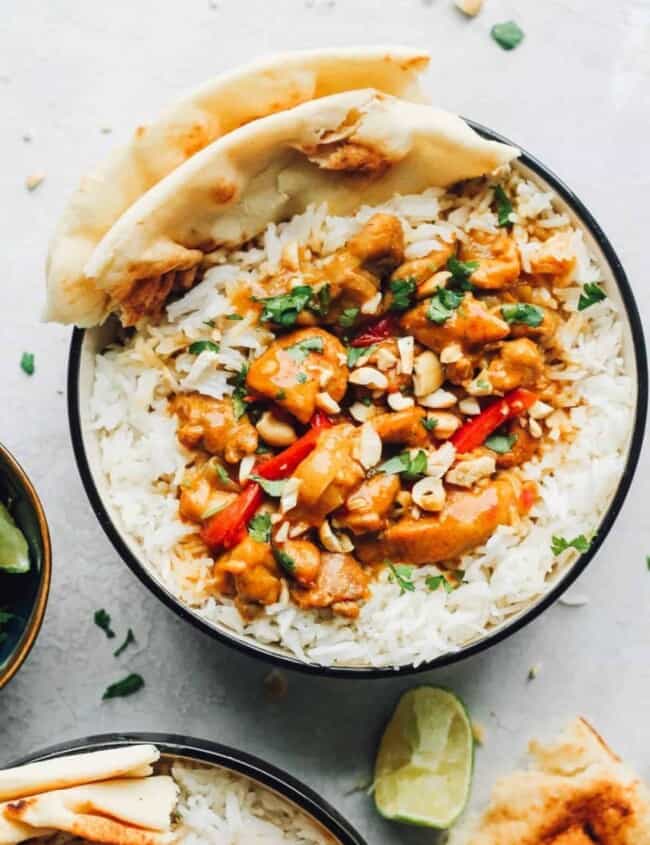 chicken curry in bowls over rice