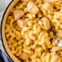 pot of chicken mac and cheese with wooden spoon