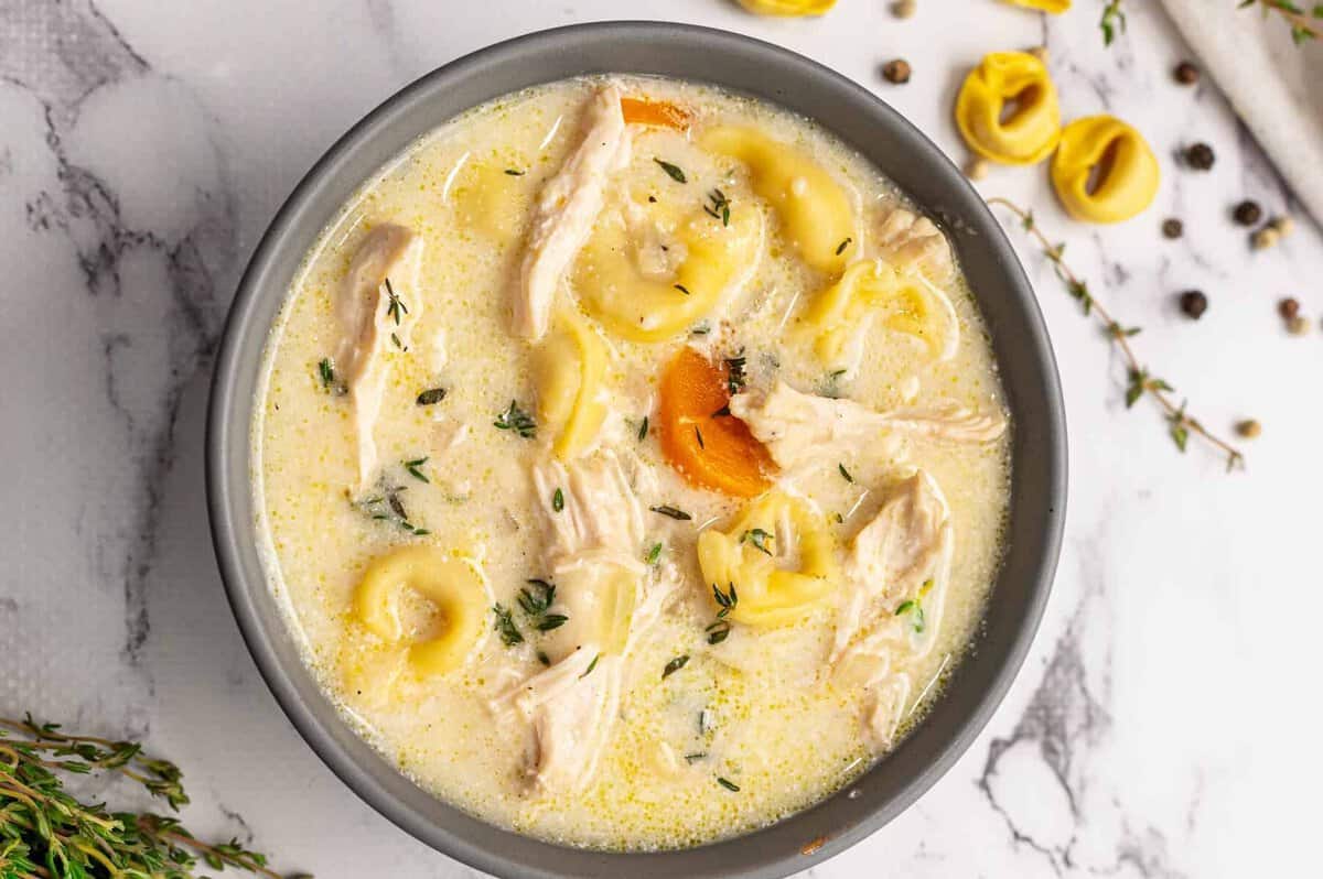 overhead image of creamy chicken tortellini soup
