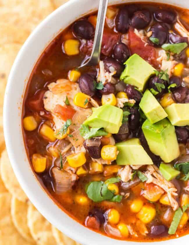 up close image of chicken chili with avocado