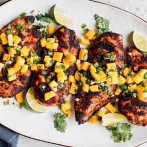 jerk chicken with pineapple salsa on platter