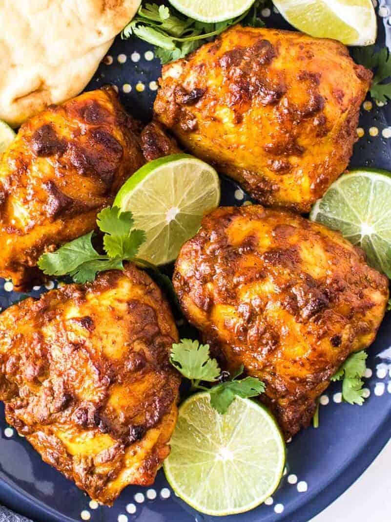 marinated tandoori chicken thighs on platter
