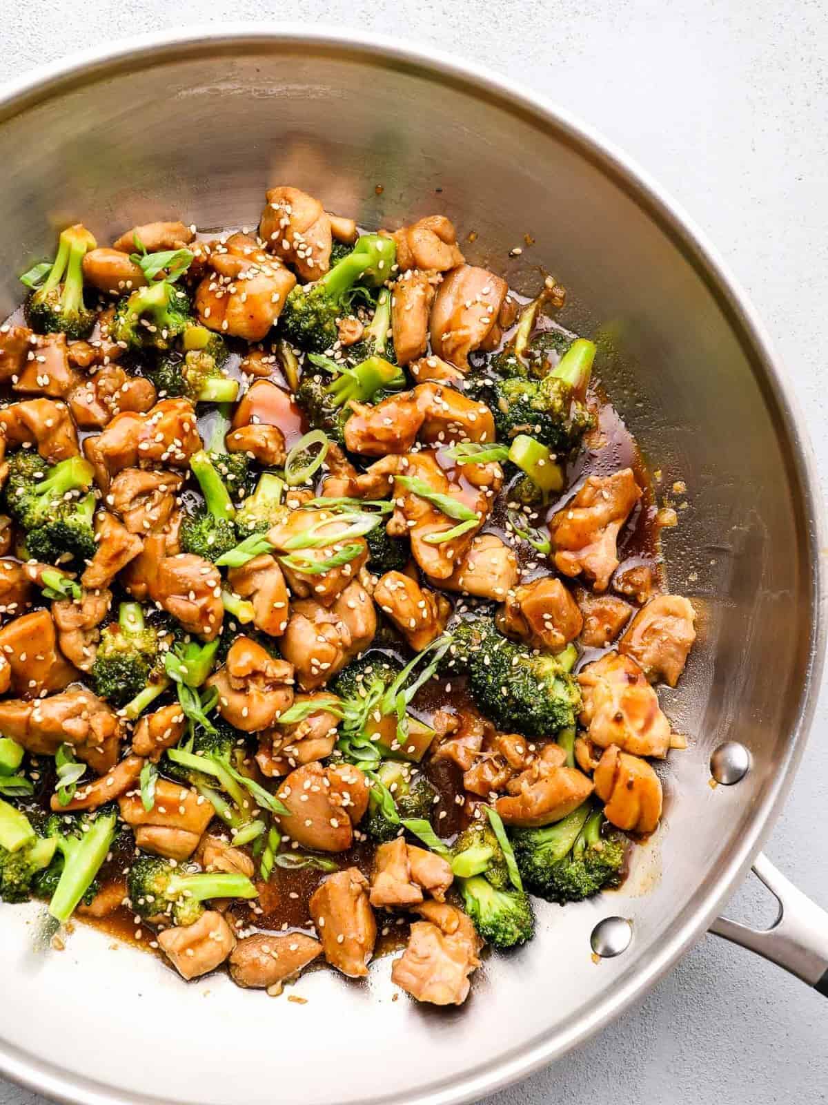 teriyaki chicken thighs and broccoli in skillet