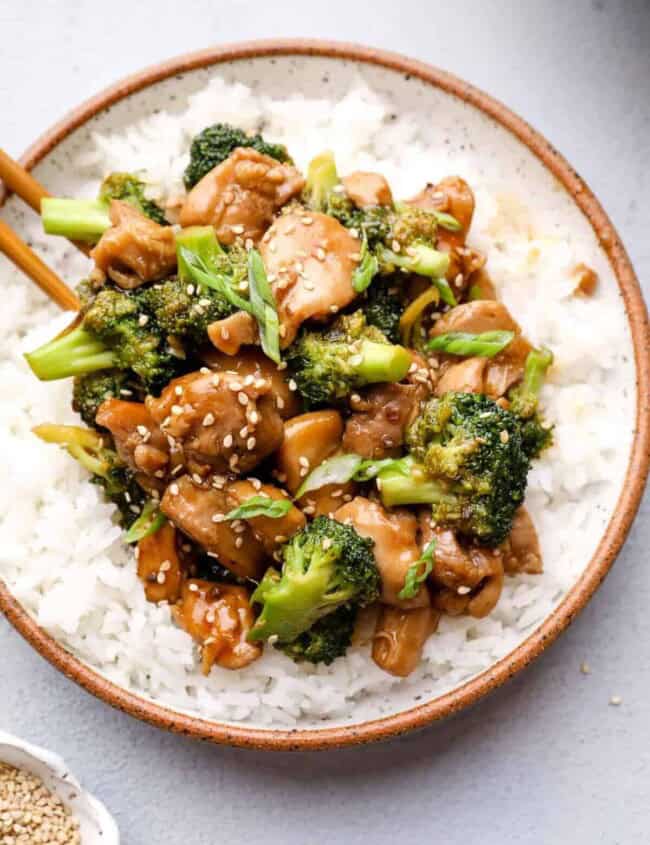 overhead image of teriyaki chicken thighs with broccoli and rice