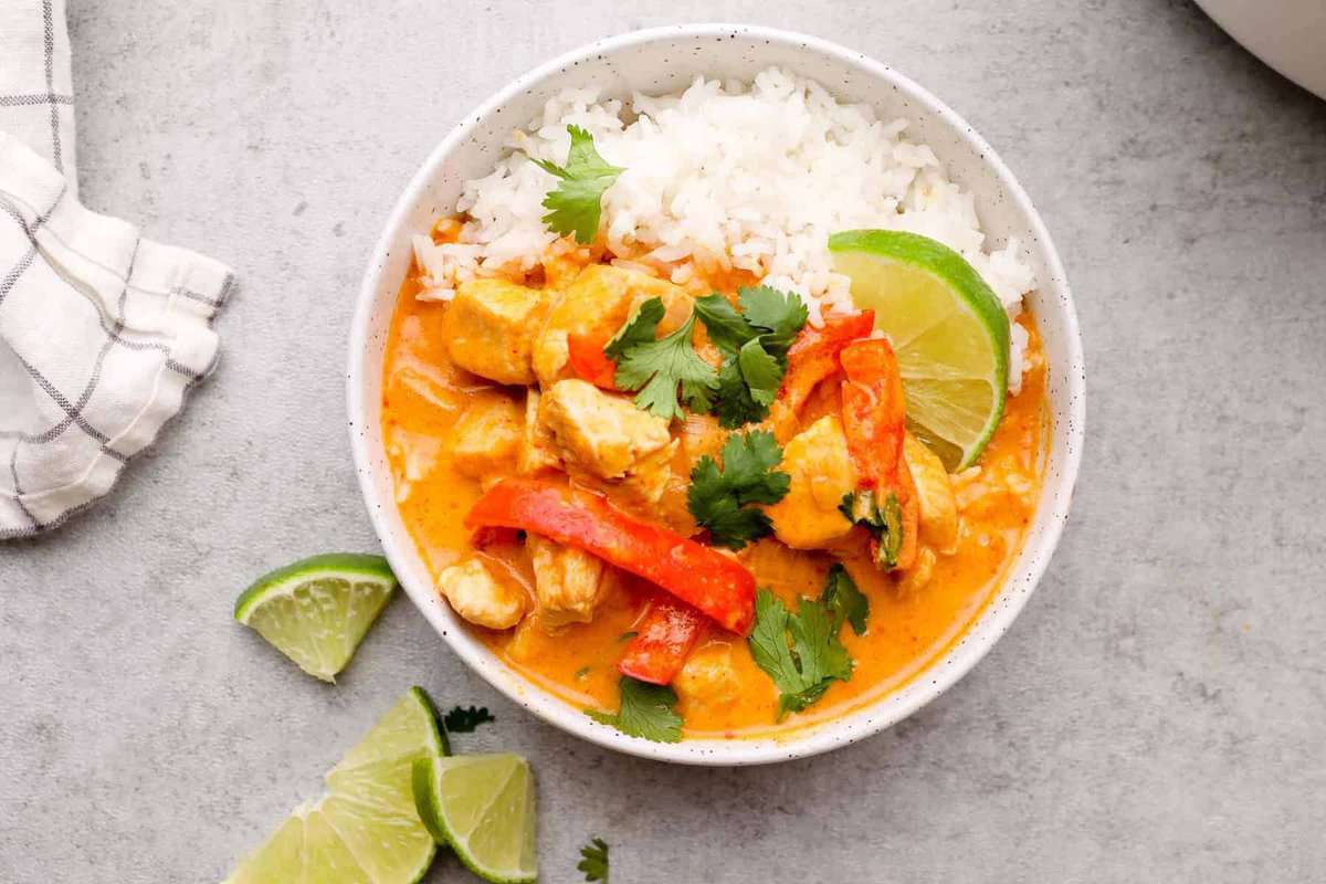 white bowl filled with red curry chicken
