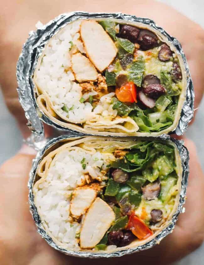 up close chipotle chicken burrito cut in half