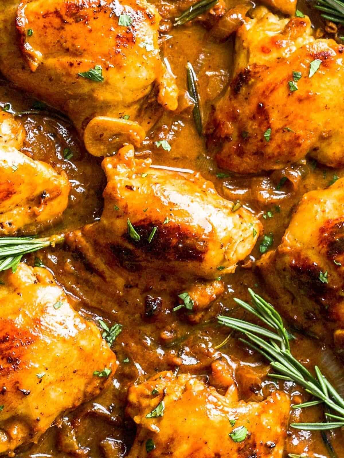 up close image of chicken thighs in honey mustard sauce