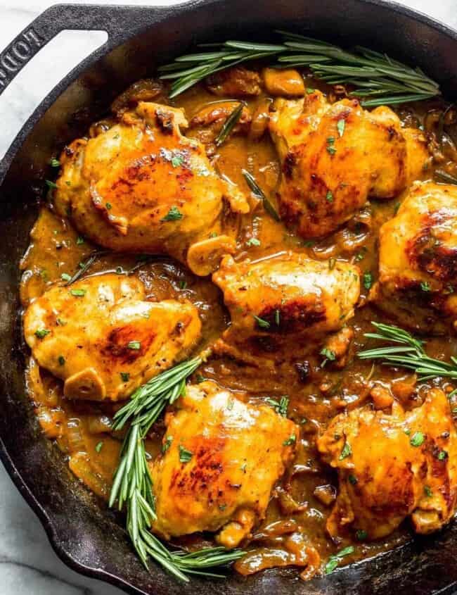 honey mustard chicken skillet garnished with rosemary