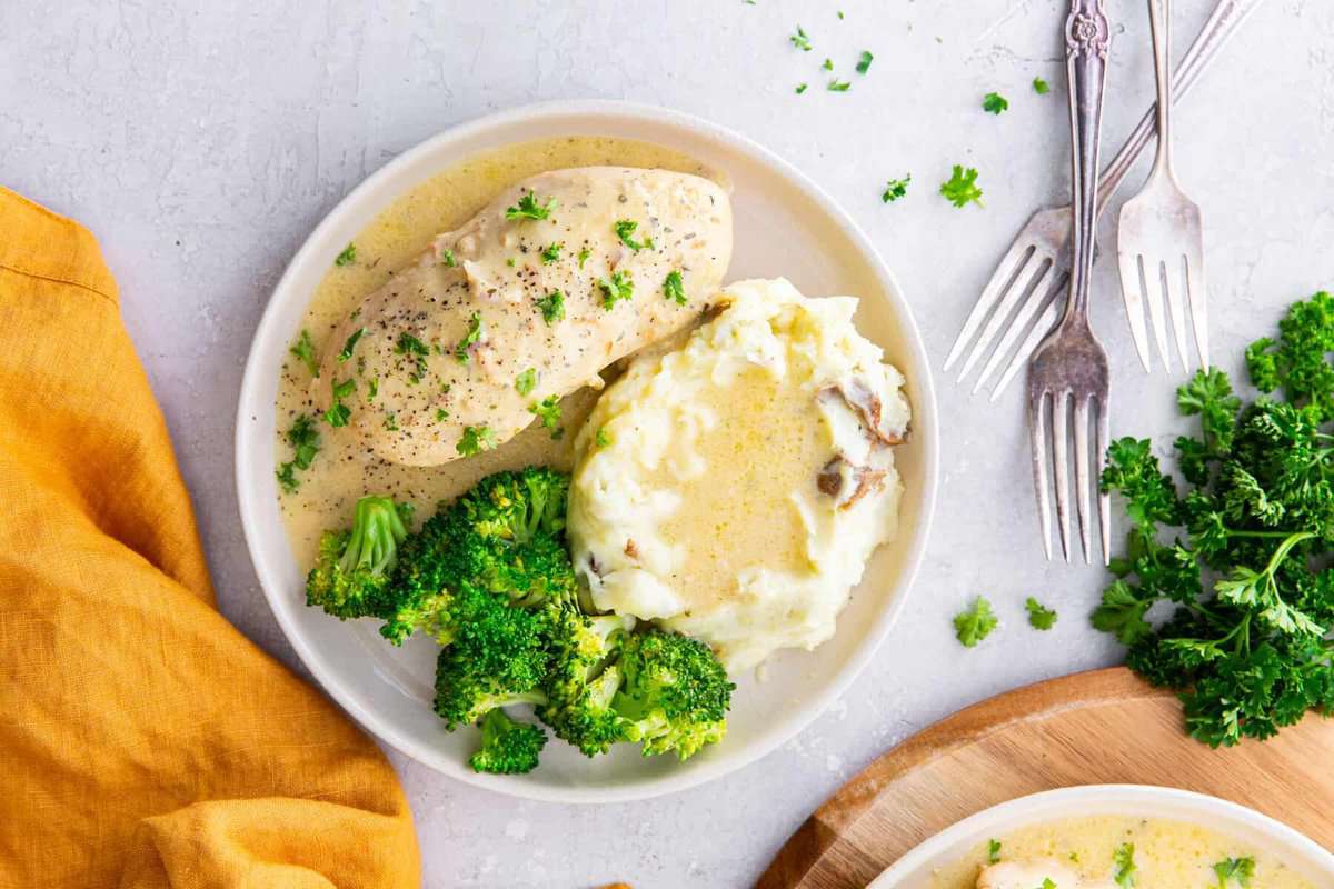 creamy ranch chicken with potatoes and broccoli, on a table