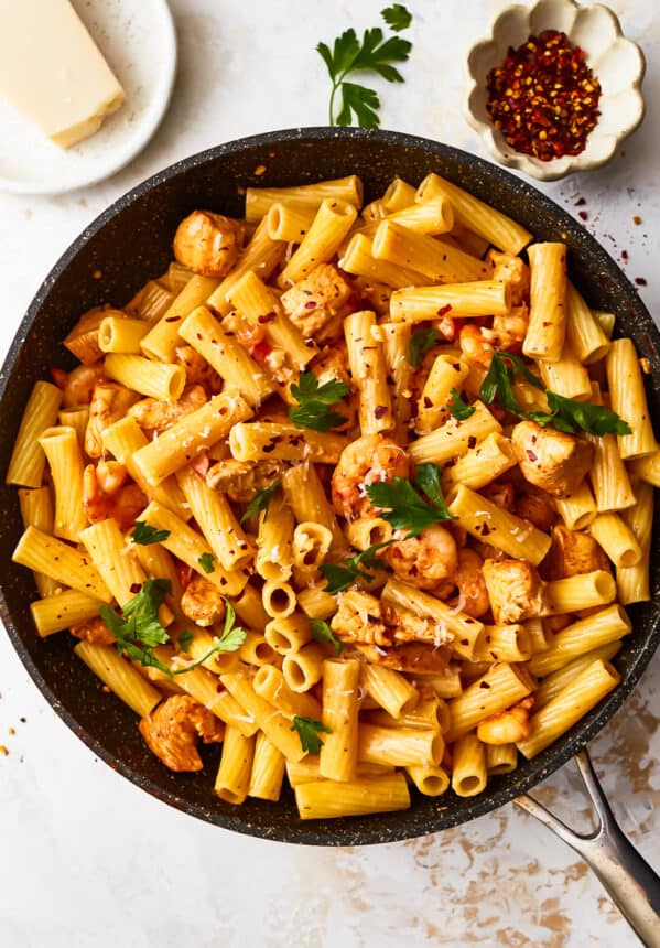 overhead view of cajun chicken pasta in a frying pan.