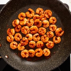 seasoned shrimp in a frying pan.